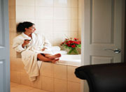 woman relaxing by her tub