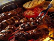 barbequed country style ribs cooking on bbq grill